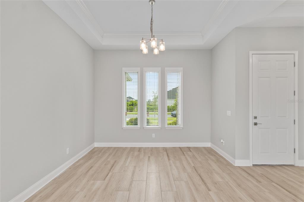 12048 Southwest 35th Place Gainesville, FL 32608 - Photo 11 of 53 wooden floor in an empty room with a window