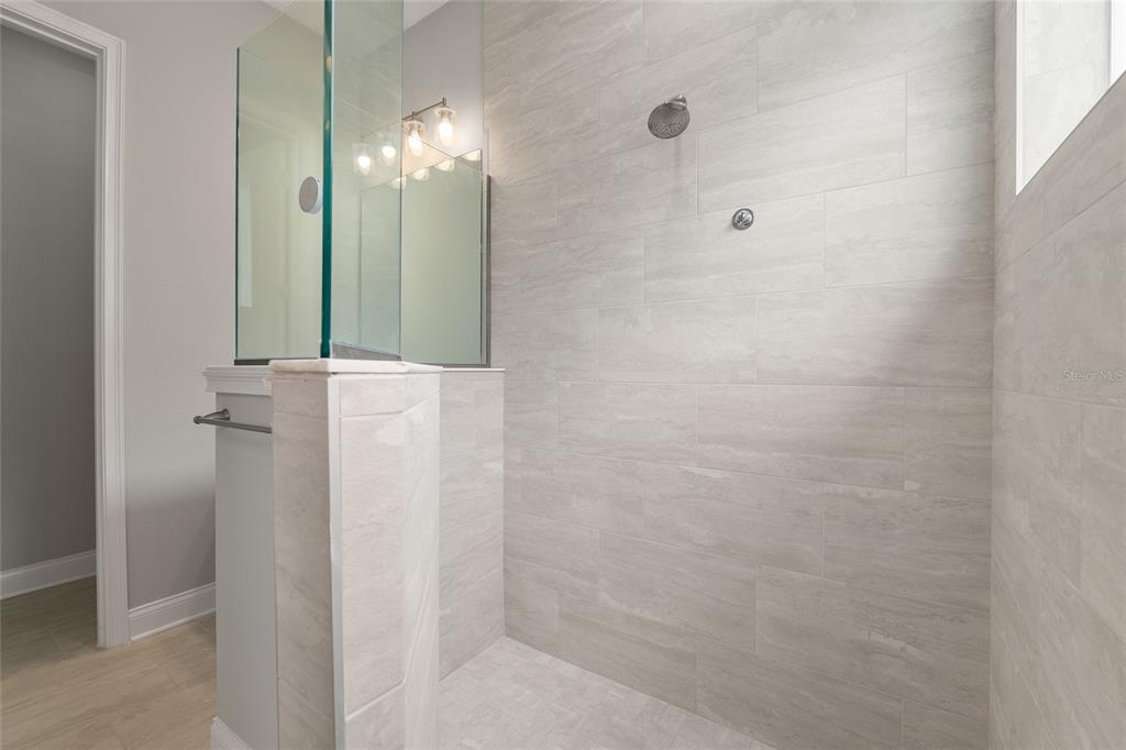 12048 Southwest 35th Place Gainesville, FL 32608 - Photo 23 of 53 a bathroom with a mirror