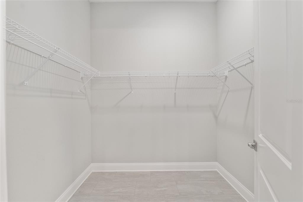 12048 Southwest 35th Place Gainesville, FL 32608 - Photo 31 of 53 a view of a room with racks on the wall