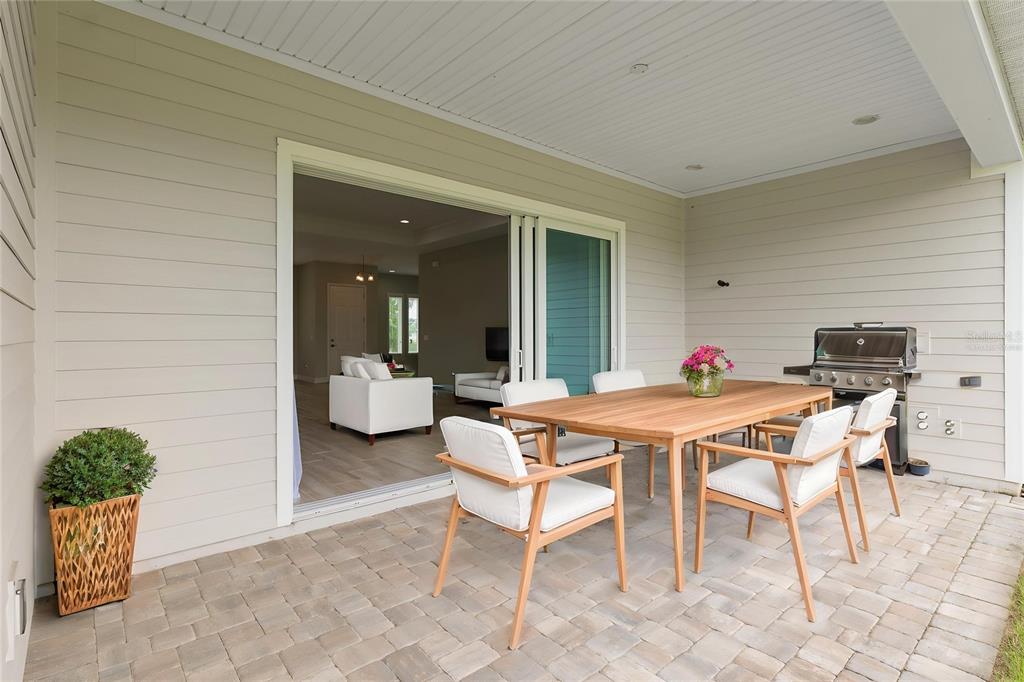 12048 Southwest 35th Place Gainesville, FL 32608 - Photo 40 of 53 a outdoor dining space with furniture and a potted plant