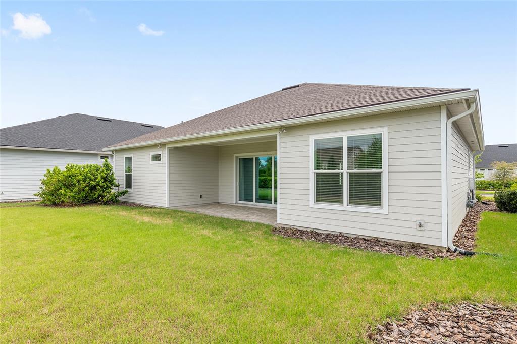 12048 Southwest 35th Place Gainesville, FL 32608 - Photo 44 of 53 a house view with a garden space