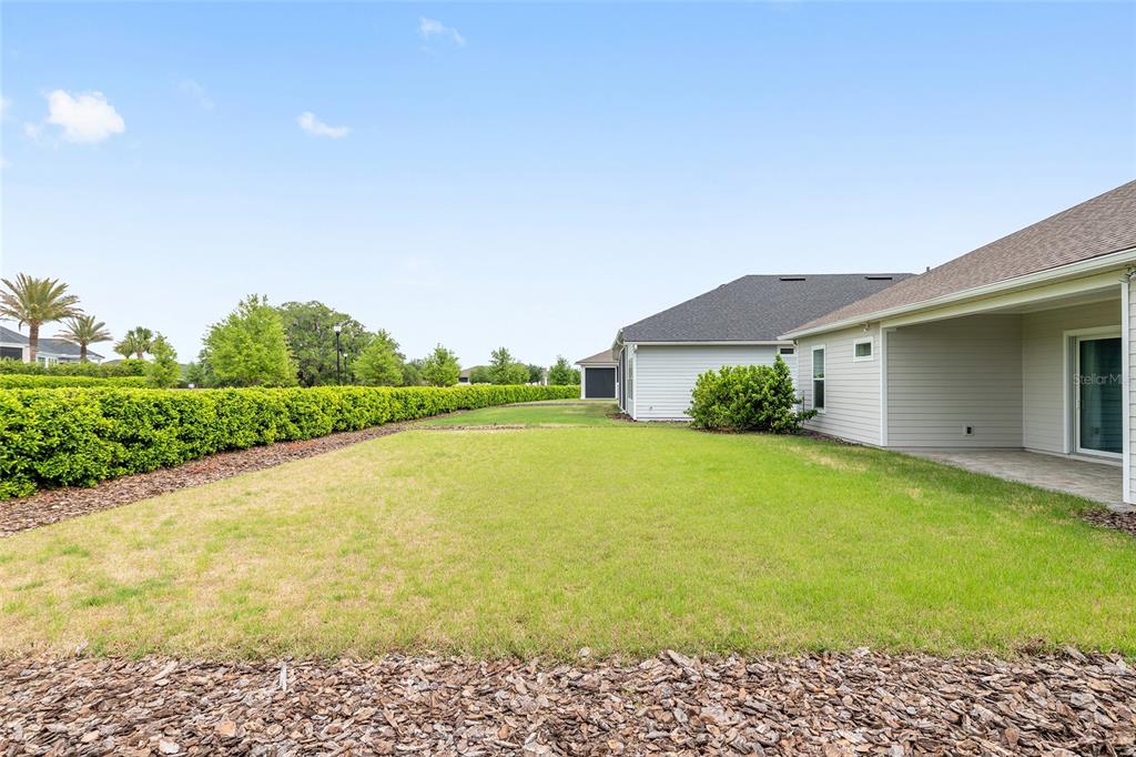 12048 Southwest 35th Place Gainesville, FL 32608 - Photo 47 of 53 a view of a house with a yard and garage