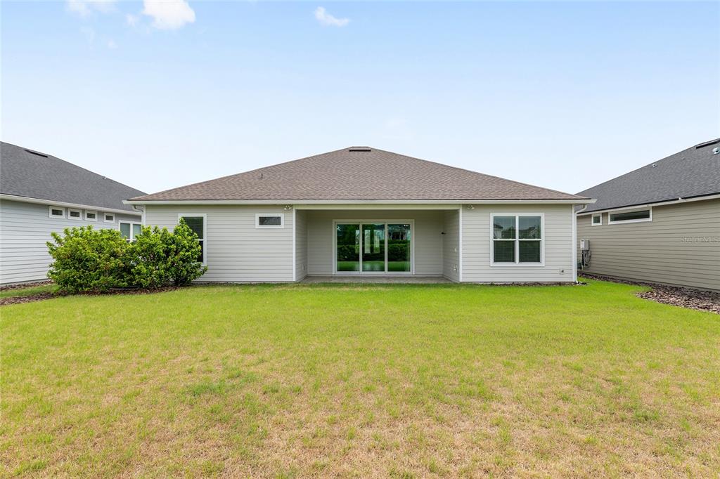 12048 Southwest 35th Place Gainesville, FL 32608 - Photo 48 of 53 a view of a house with a garden