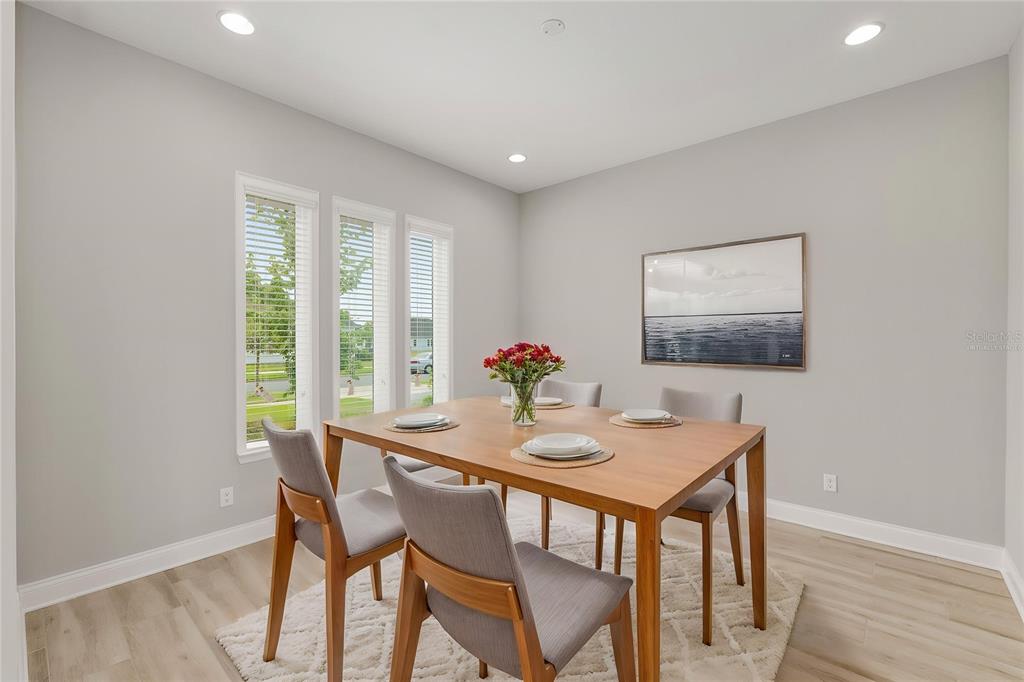 12048 Southwest 35th Place Gainesville, FL 32608 - Photo 10 of 53 a view of a dining room with furniture window and outside view