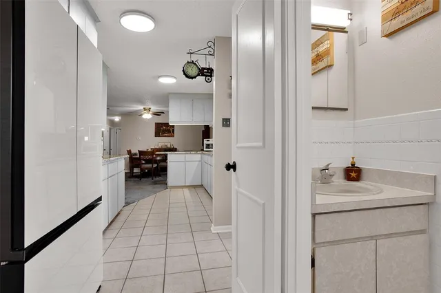 a view of a kitchen with microwave and sink