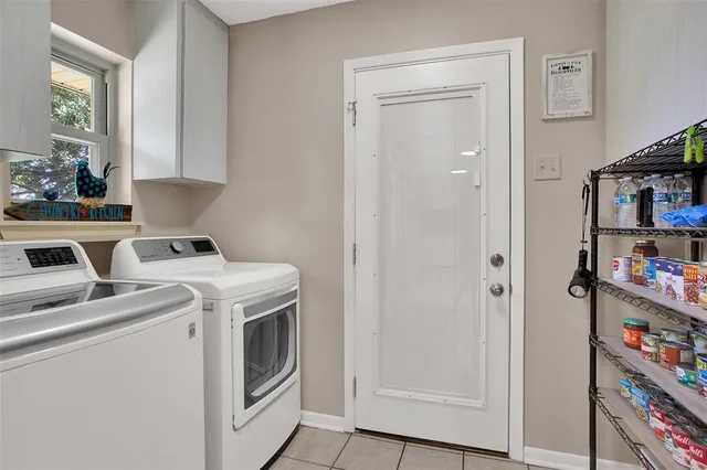a view of storage and utility room with washer and dryer
