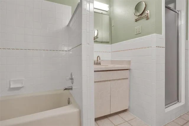 a bathroom with a sink a mirror and a bathtub