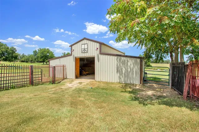 a view of a house with a yard and garage