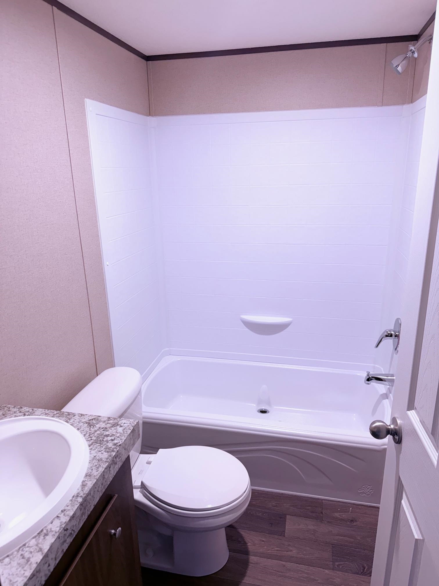 1252 Mallard Court Conway, SC 29526 - Photo 8 of 38 Bathroom with dark wood-style flooring, shower / washtub combination, and vanity