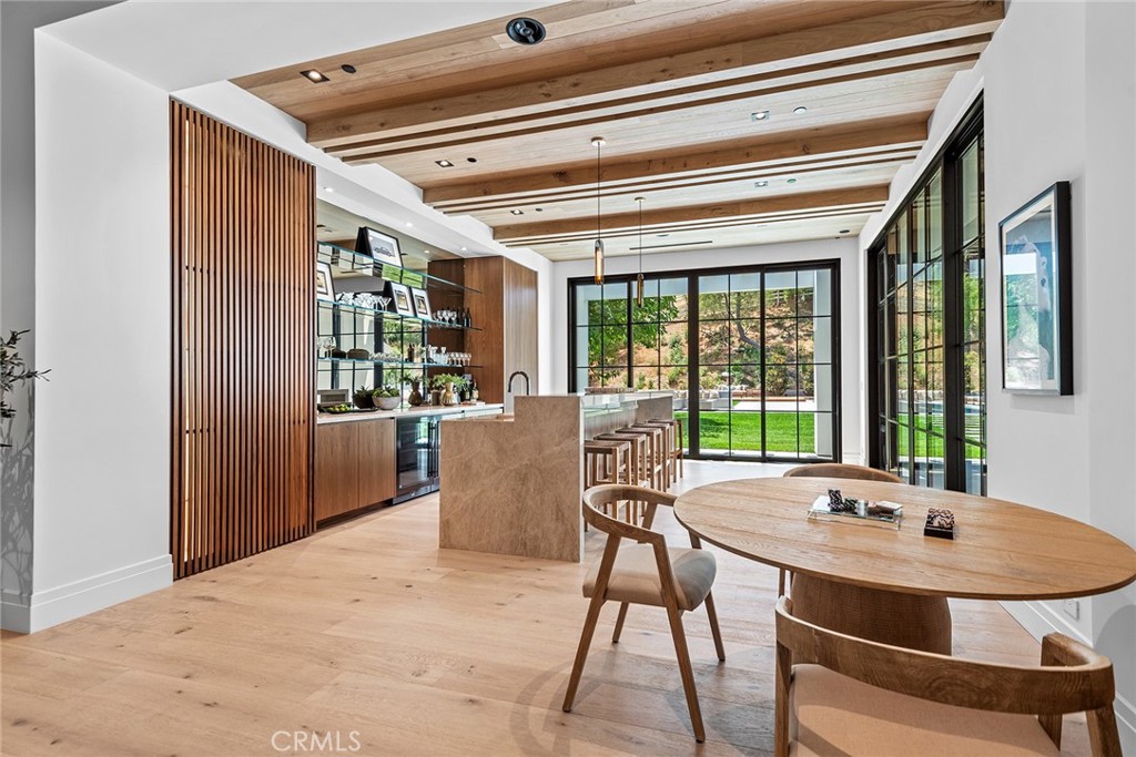 24044 Long Valley Road Hidden Hills, CA 91302 - Photo 15 of 57 a view of a dining room with furniture window and outside view