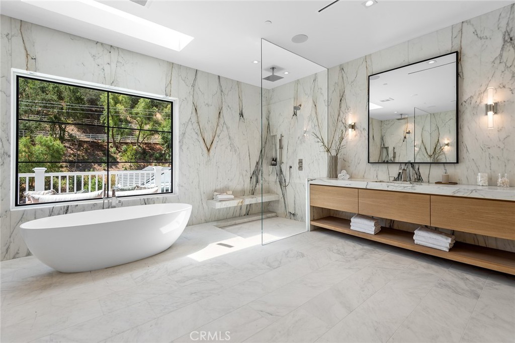24044 Long Valley Road Hidden Hills, CA 91302 - Photo 28 of 57 a spacious bathroom with sink shower and bathtub