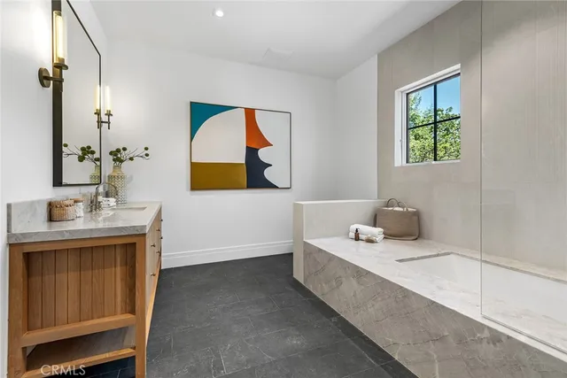 a bathroom with a sink toilet and mirror