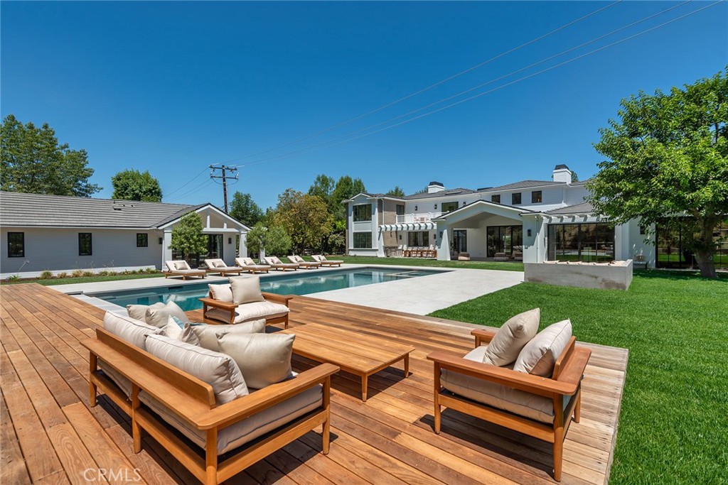 24044 Long Valley Road Hidden Hills, CA 91302 - Photo 51 of 57 a view of a house with a backyard and a sitting area