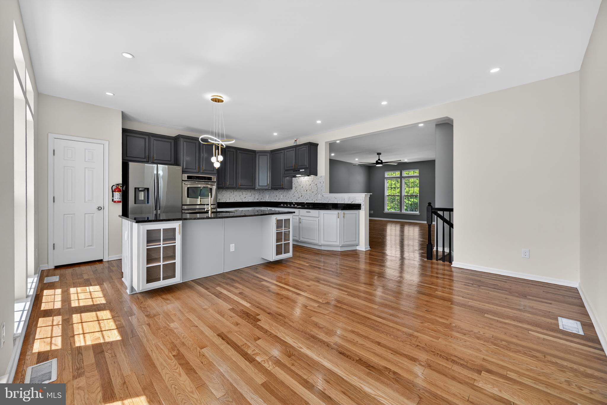 3 Swan Court Delran, NJ 08075 - Photo 17 of 34 a large kitchen with stainless steel appliances granite countertop a stove and a refrigerator