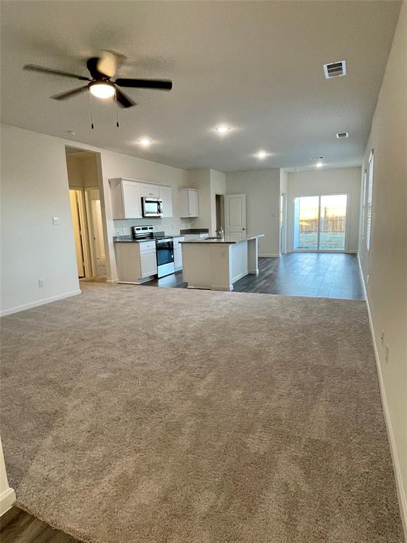6222 Old Bridge Way Forney, TX 75126 - Photo 2 of 17 a view of a kitchen with a sink and a refrigerator