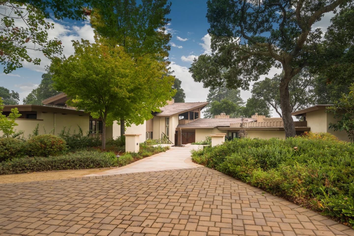 a house with trees in front of it