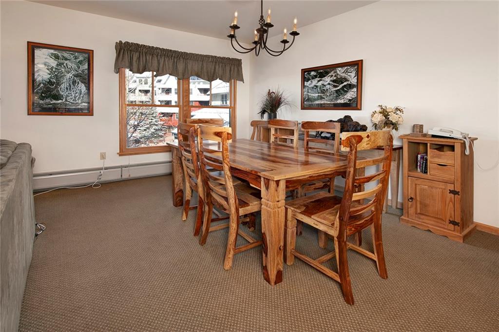 195 River Run Road, Unit 8017 Keystone, CO 80435 - Photo 11 of 32 a view of a dining room with furniture window and outside view