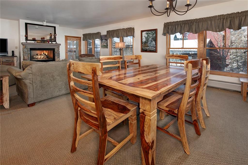 195 River Run Road, Unit 8017 Keystone, CO 80435 - Photo 12 of 32 a dining room with furniture and window