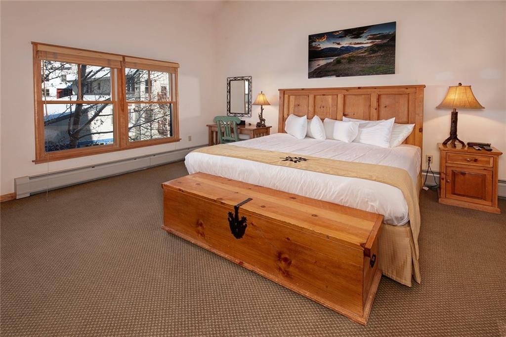 195 River Run Road, Unit 8017 Keystone, CO 80435 - Photo 13 of 32 a bed sitting in a bedroom next to a window