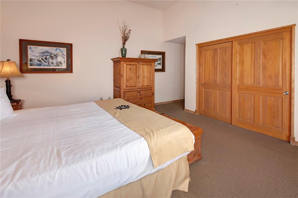 195 River Run Road, Unit 8017 Keystone, CO 80435 - Photo 15 of 32 a bedroom with a bed and a closet