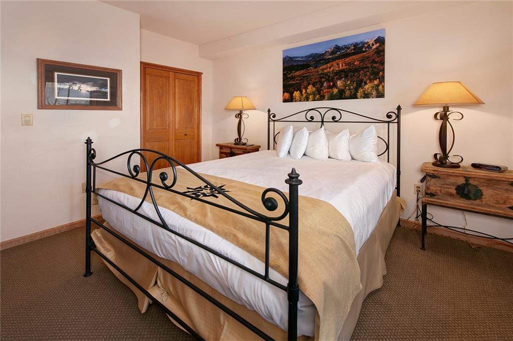 195 River Run Road, Unit 8017 Keystone, CO 80435 - Photo 19 of 32 a bedroom with bed and a window