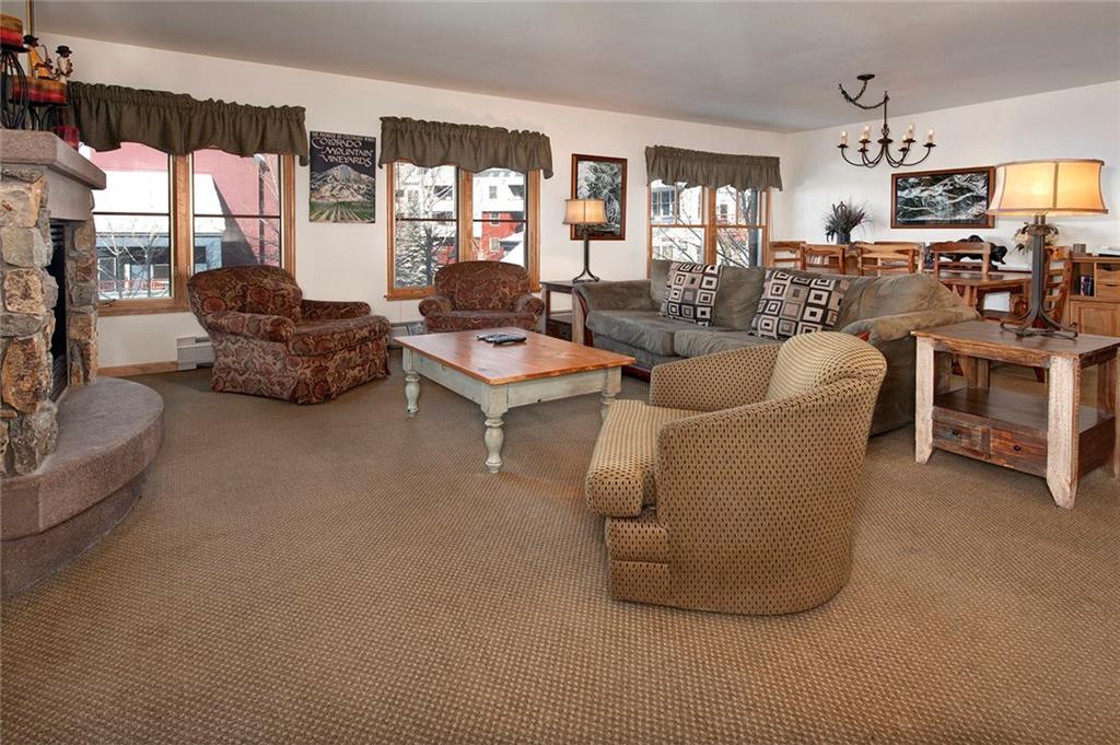 195 River Run Road, Unit 8017 Keystone, CO 80435 - Photo 3 of 32 a living room with furniture and a flat screen tv