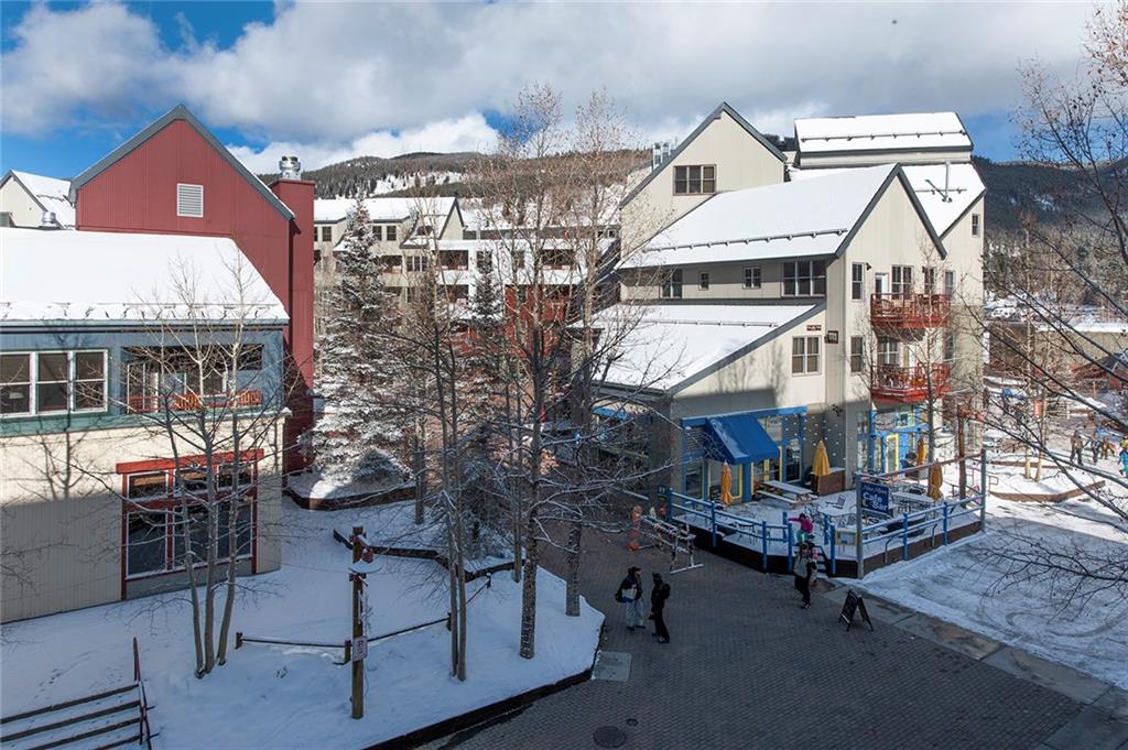 195 River Run Road, Unit 8017 Keystone, CO 80435 - Photo 25 of 32 a view of a building with a bench
