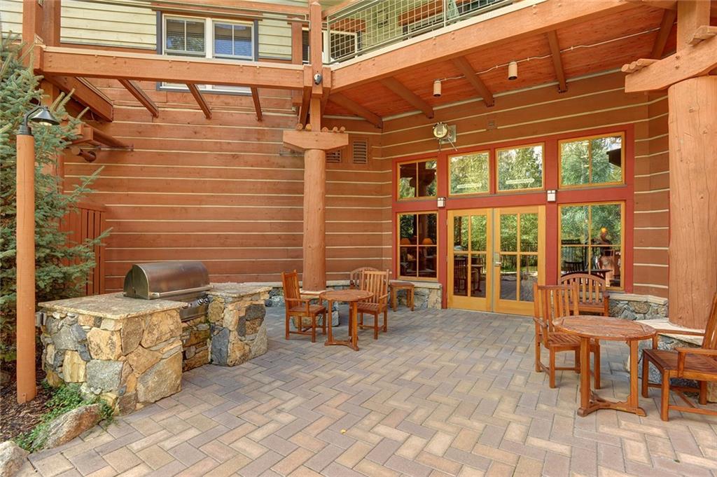 195 River Run Road, Unit 8017 Keystone, CO 80435 - Photo 31 of 32 a view of a patio with table and chairs and couches