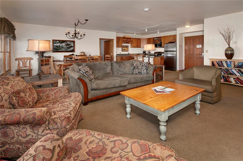 195 River Run Road, Unit 8017 Keystone, CO 80435 - Photo 5 of 32 a living room with furniture and a flat screen tv