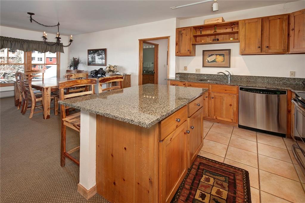195 River Run Road, Unit 8017 Keystone, CO 80435 - Photo 10 of 32 a kitchen with stainless steel appliances granite countertop a sink and a stove