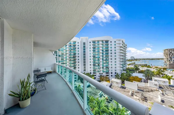 a view of balcony with furniture