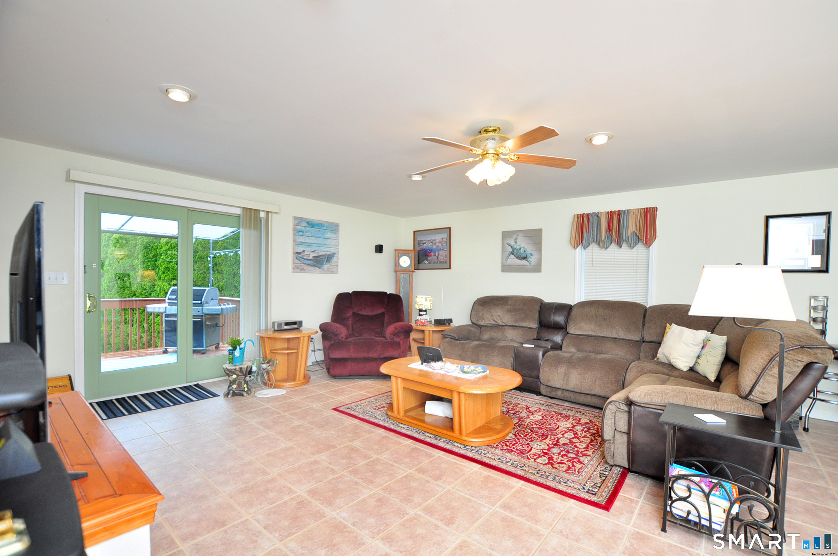 20 Lawrence Lane Torrington, CT 06790 - Photo 27 of 40 GREAT room! Sliders leading to the deck and backyard.
