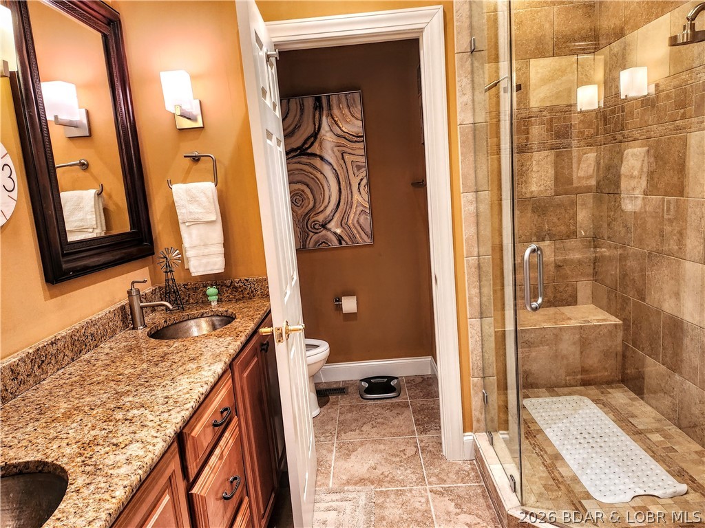 70 Via Da Contro Sunrise Beach, MO 65079 - Photo 9 of 32 Granite and Marble Master Bath.