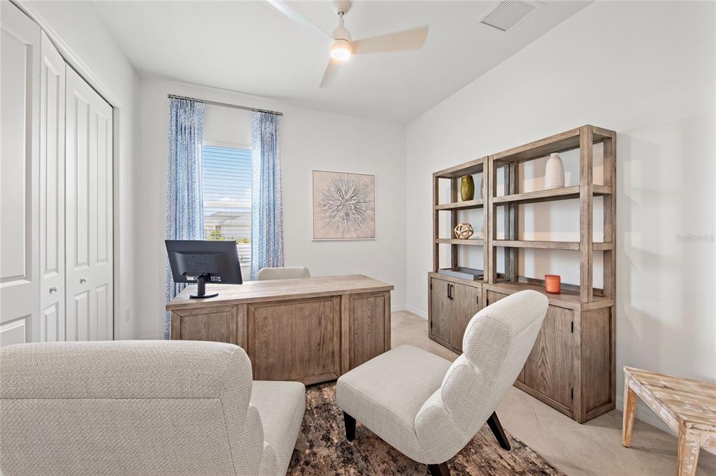7161 Inlet Isles Lakewood Ranch, FL 34202 - Photo 22 of 29 a living room with furniture a rug and a window