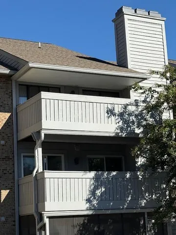 a view of balcony with furniture