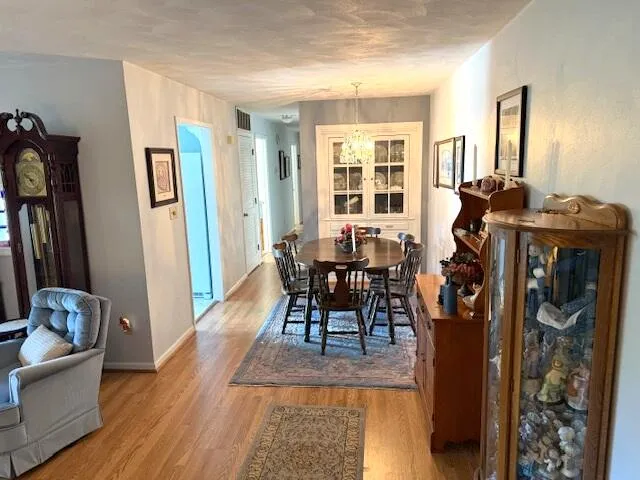 a dining room with furniture and window