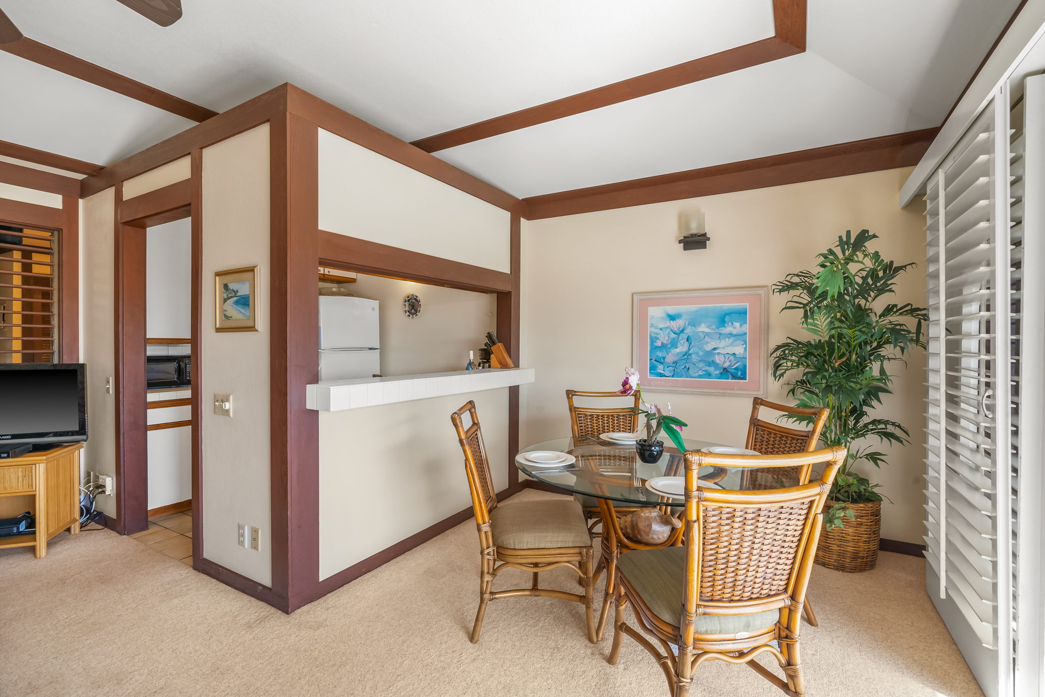 2253 Poipu Road, Unit 109 Koloa, HI 96756 - Photo 9 of 12 a dining room with furniture and window