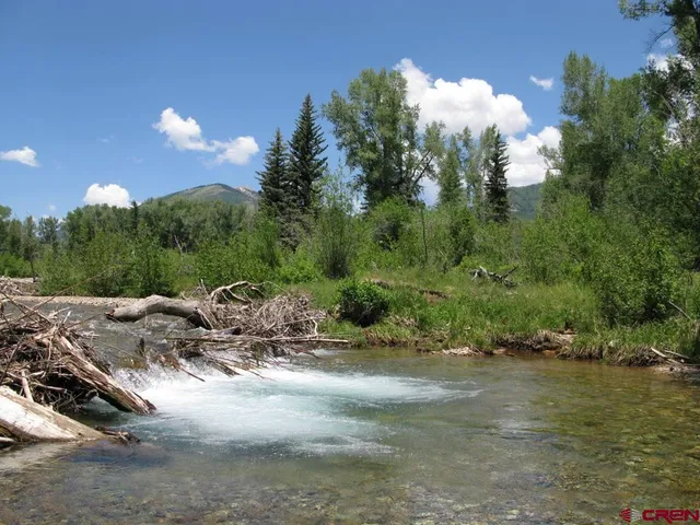 a view of a town with trees around