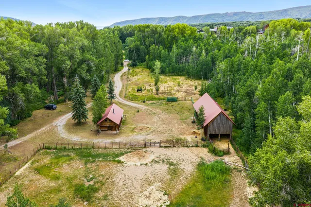 a view of a backyard of the house