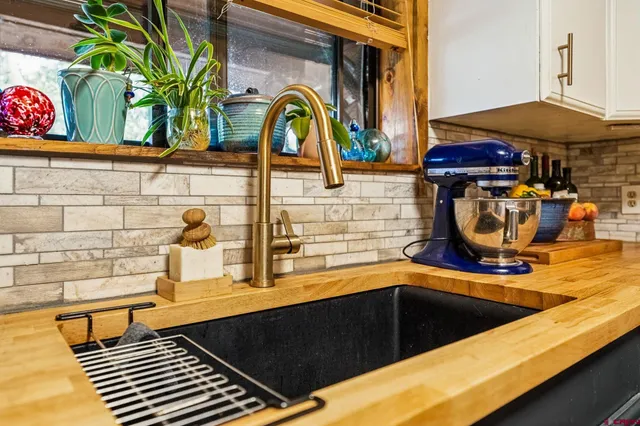 a kitchen with a sink and a stove