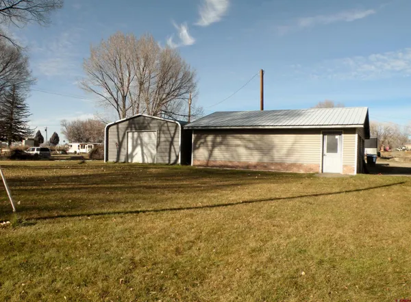 a view of pool and front door