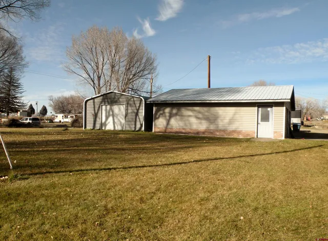 a view of pool and front door