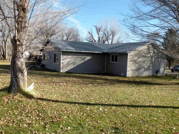 a view of a backyard of the house