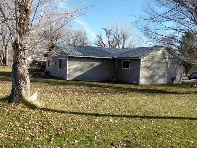 a view of a backyard of the house