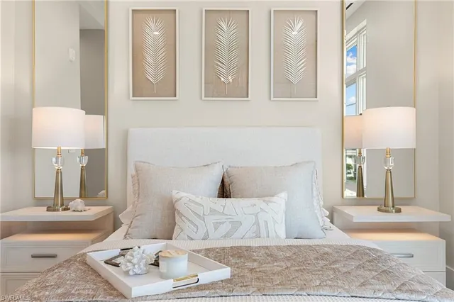 a bedroom with a bed and a mirror