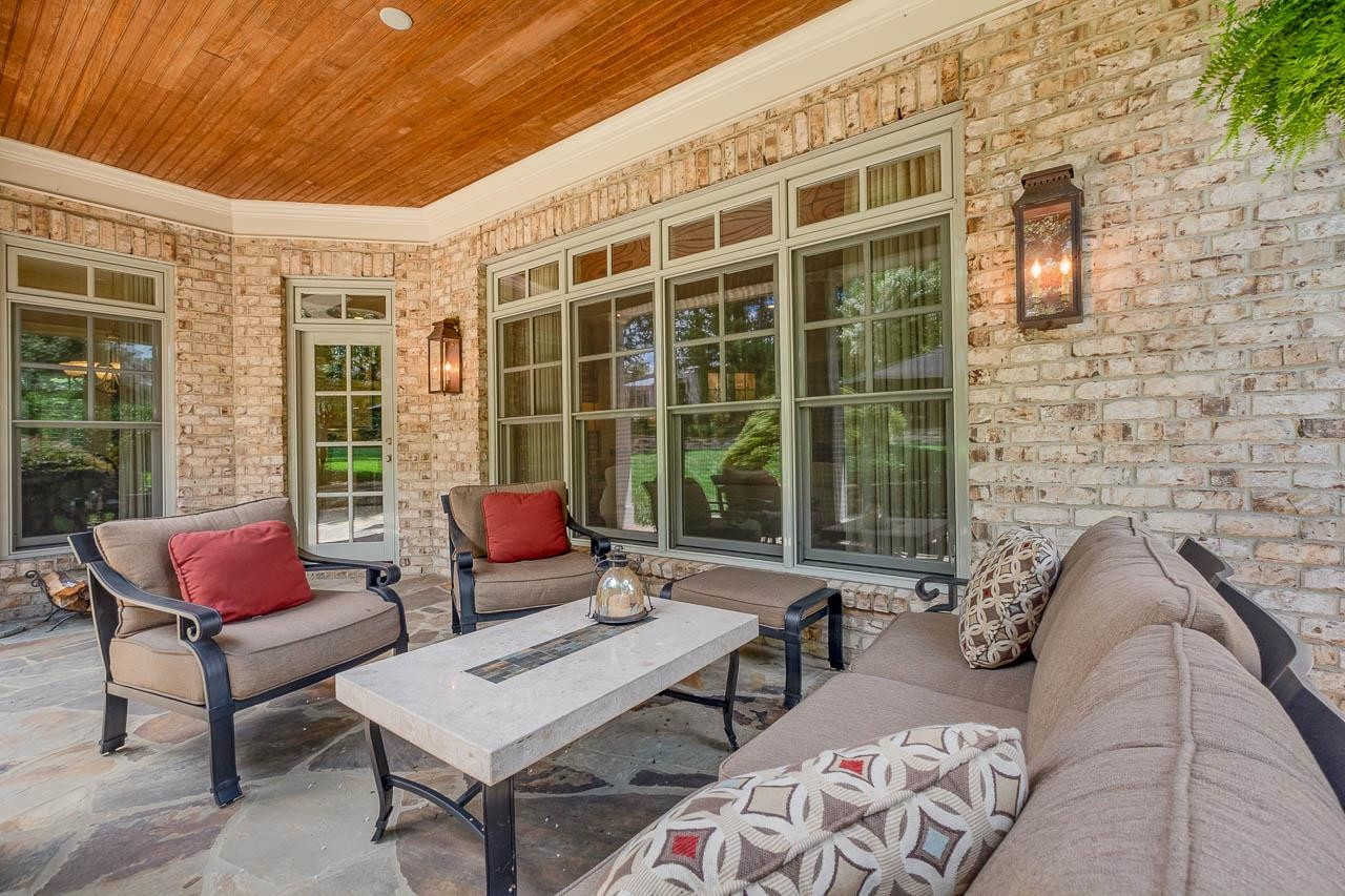 2129 Buckingham Road Raleigh, NC 27607 - Photo 8 of 52 Enjoy the outdoor year round in the covered Patio. Spacious Stone Patio