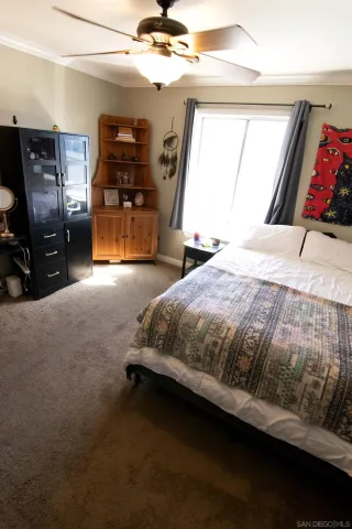 a bedroom with a bed and window