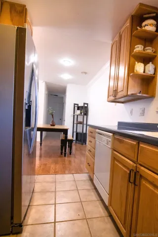 a kitchen with stainless steel appliances granite countertop sink and cabinets