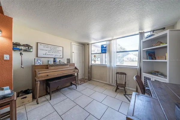 a bedroom with furniture and a window