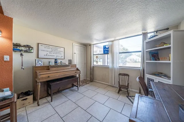 a bedroom with furniture and a window
